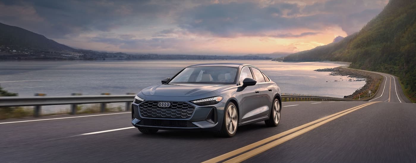 Grey 2025 Audi A5 driving near the ocean